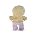 Crocheted yellow and pink variegated bear in a yellow hoodie on a white background