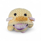Crocheted yellow duck hoodie on a pink and yellow bear on a white background