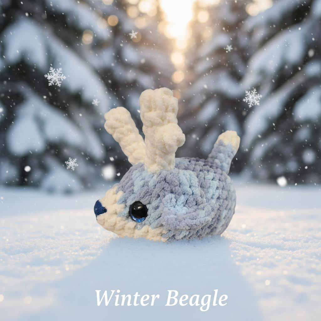 Crochet reindeer beagle with blue and white fur, gradient blue accents, and antlers on a white background