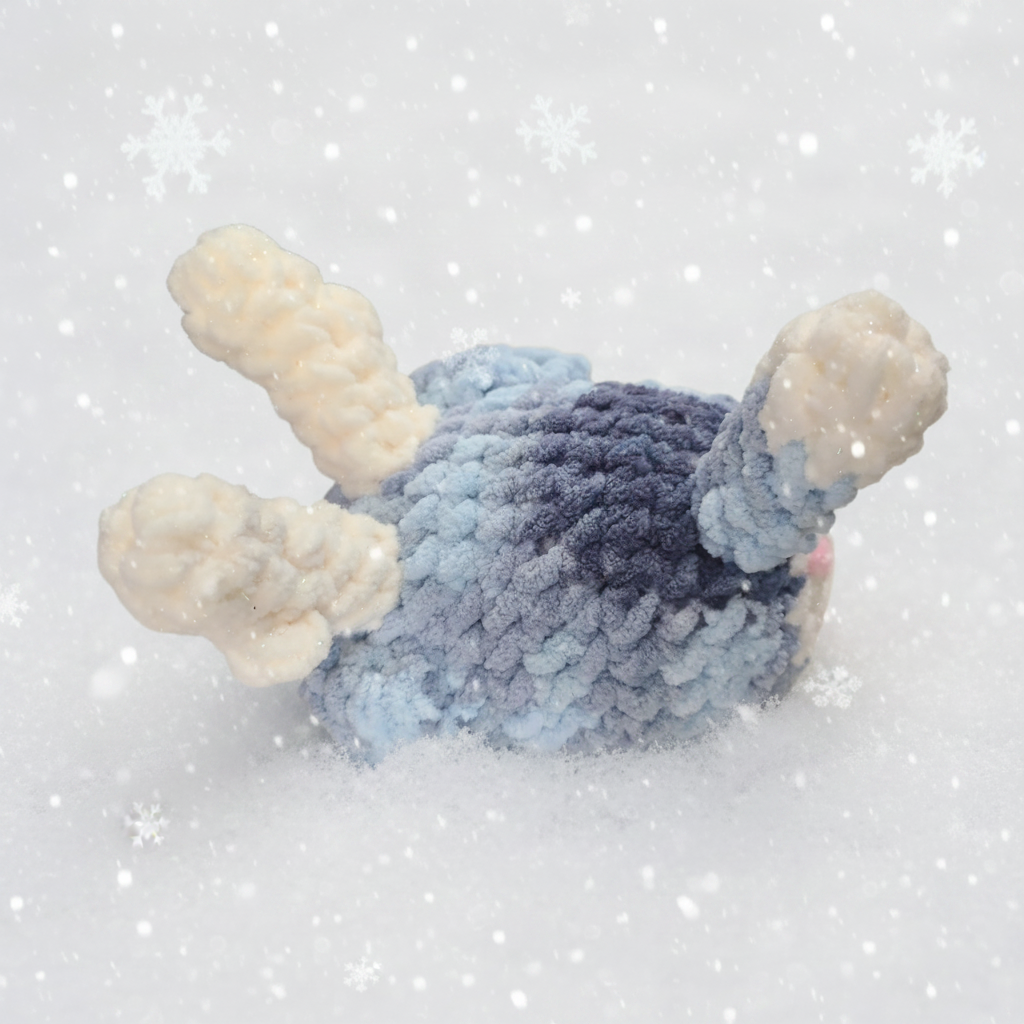 Crochet reindeer beagle with blue and white fur, gradient blue accents, and antlers on a white background