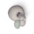 Bottom of a white Crocheted chicken with hole to hide eggs in on a light background